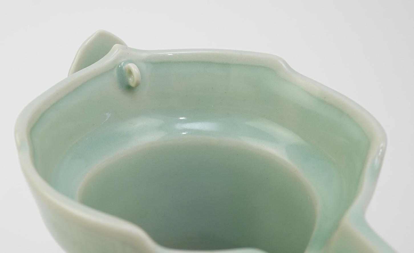 A Chinese incised celadon glazed monks cap ewer, Qianlong seal mark but later, 17cm